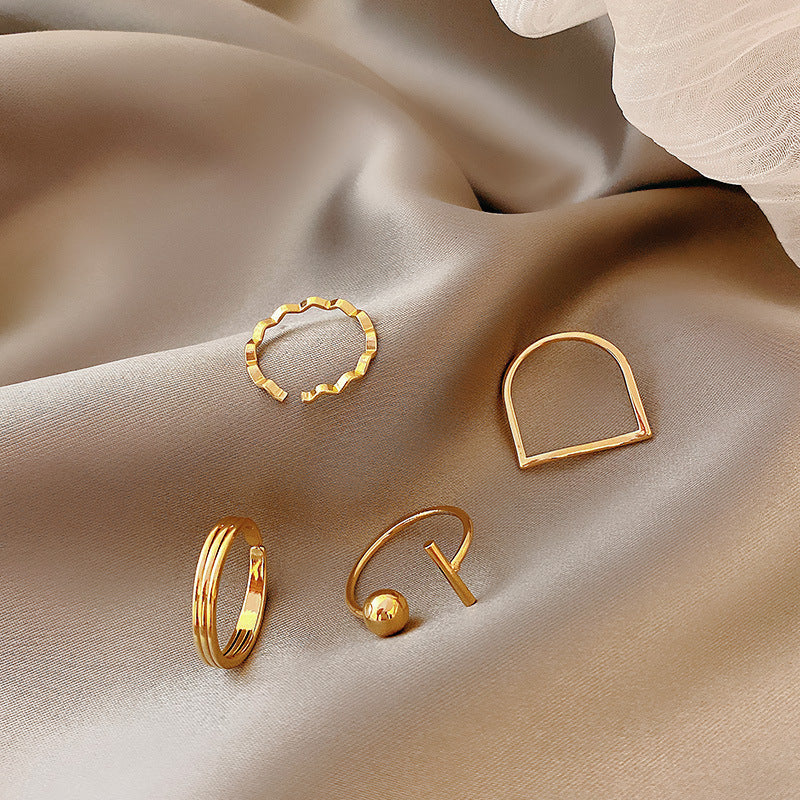 Four-piece Ring Set with irregular plain circle in Gold -J200G